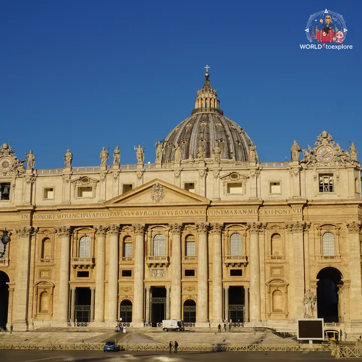 The façade of St Peter's Basilica in the early morning, with Michelangelo's dome behind it and the square still almost empty