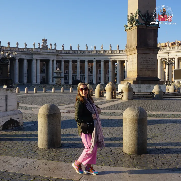 The author beside the obelisk in St Peter's Square, with Bernini's colonnade and one of the fountains behind