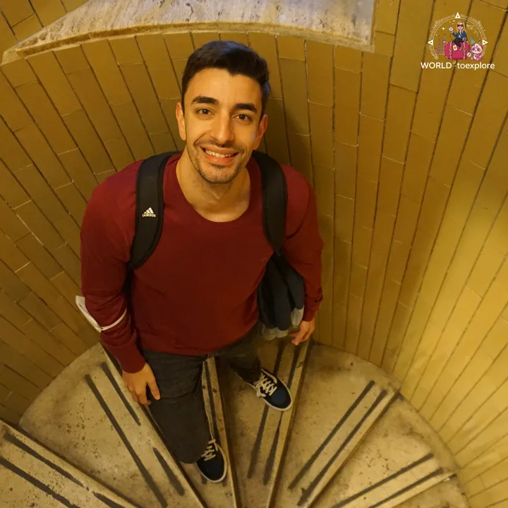 The author's partner climbing the spiral staircase of the dome, seen from above
