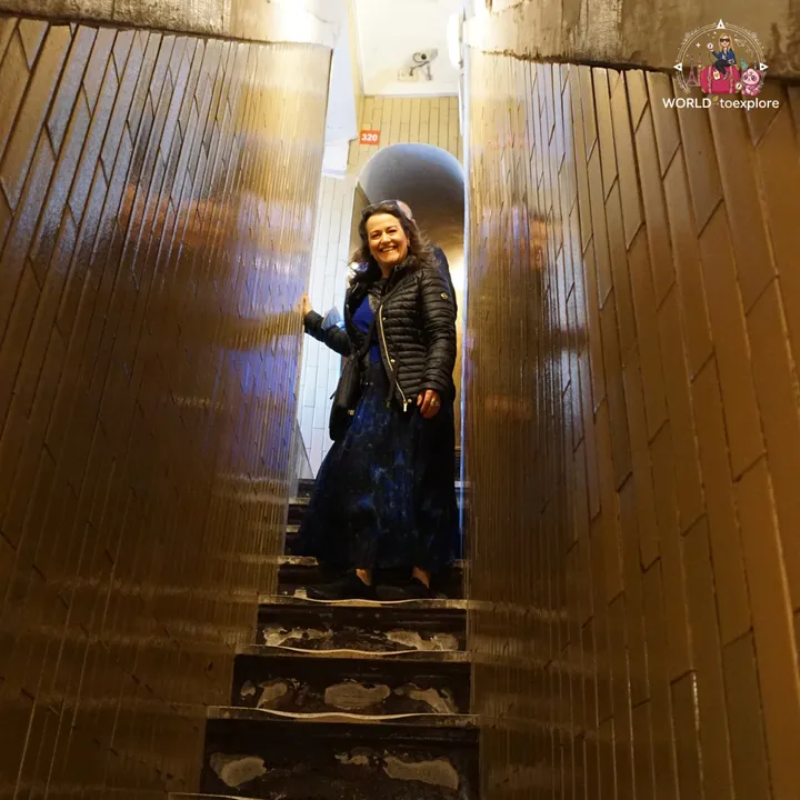 The author's mother on one of the narrow staircases of the dome, next to the 320-step mark