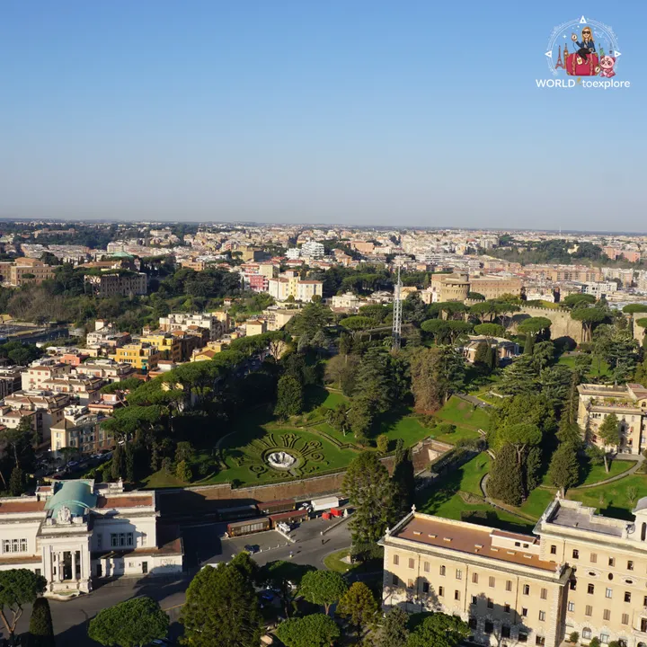 View from the top of the dome over the Vatican Gardens and the rooftops of Rome