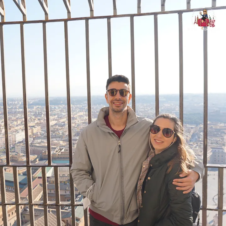 The author and her partner at the top of the dome, with Rome stretching out behind the bars