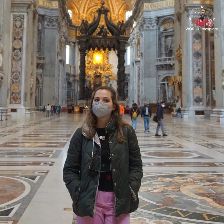 The author in the nave of St Peter's Basilica, with Bernini's baldachin lit up in the background