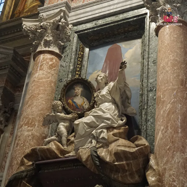 One of the funerary monuments in the basilica, with a winged marble figure and a medallion holding a portrait