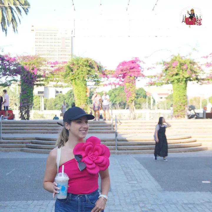The Grand Arbour at South Bank, covered in pink bougainvillea, on a sunny day