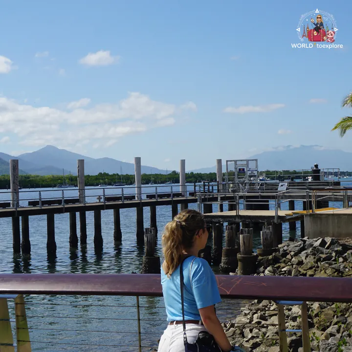 At the Cairns marina, with the pier and mountains behind