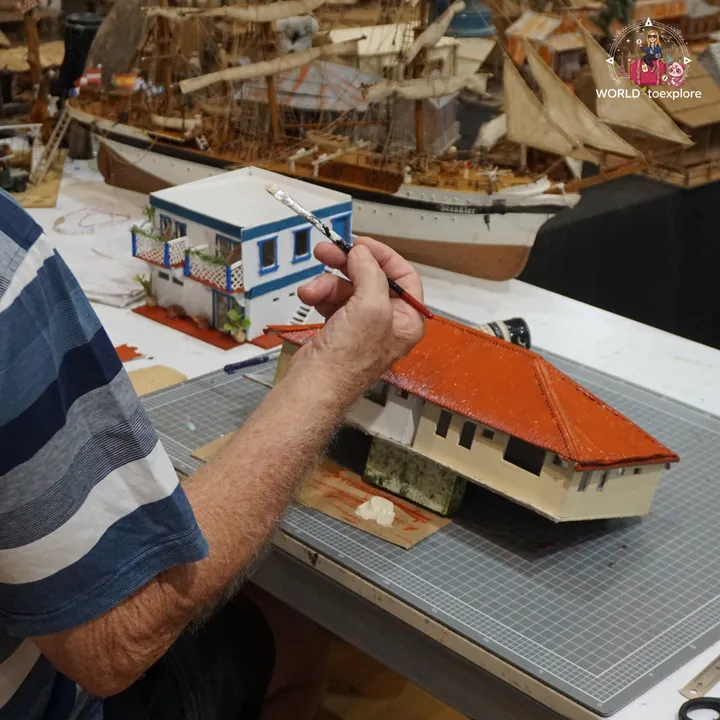 A detail of Col's Historical Miniatures, with the miniature houses being painted