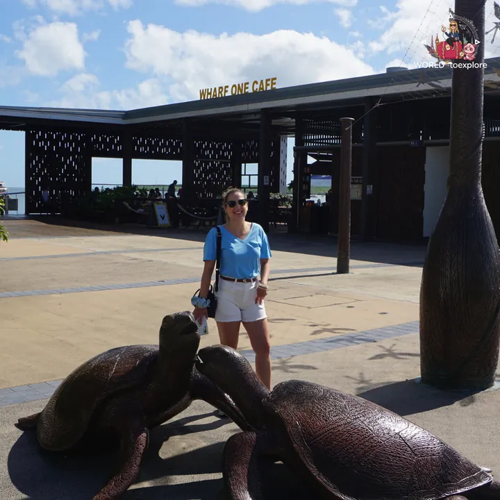 By the turtle sculptures, near the Cairns marina