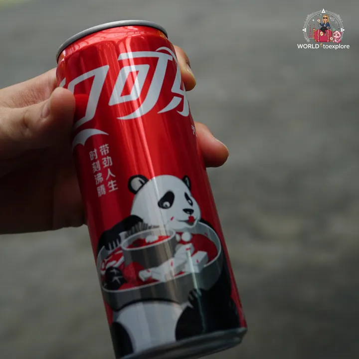 Coca-Cola can featuring an illustration of a giant panda, a design inspired by China