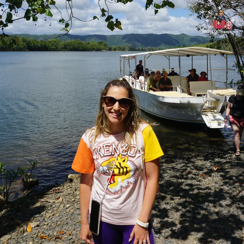 By the cruise boat, with the Daintree River and mountains in the background