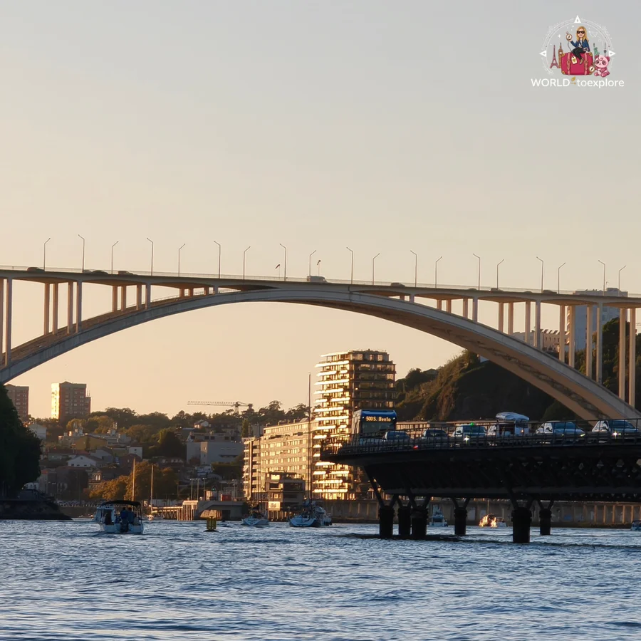 The Arrábida Bridge seen from the River Douro in the late afternoon, in the golden light of the sunset
