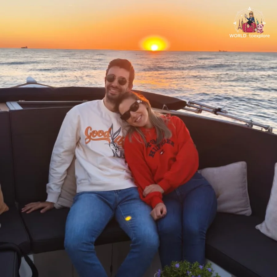 Cristina and António, in a white sweater, cuddled up on the Wondy's seats watching the sunset over the Atlantic Ocean