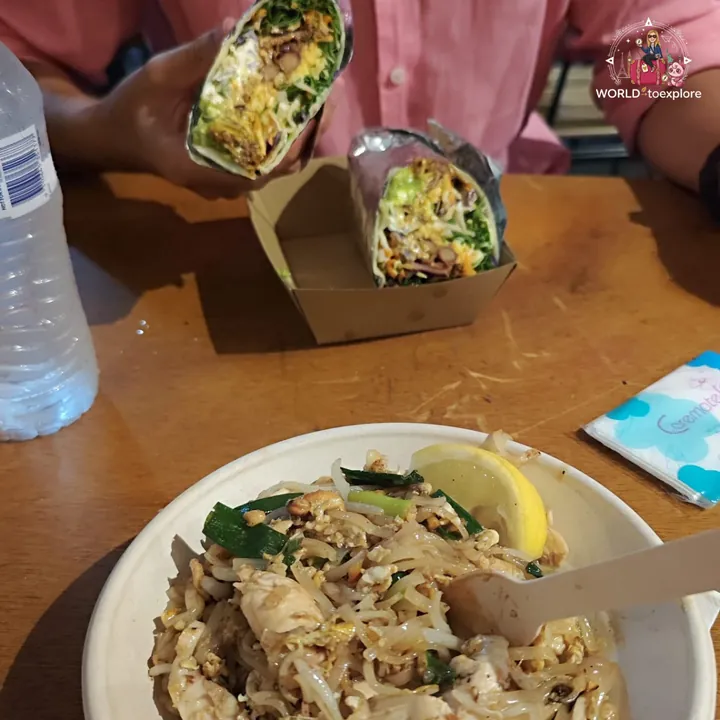 Street food dishes at Miami Marketta, with noodles and wraps