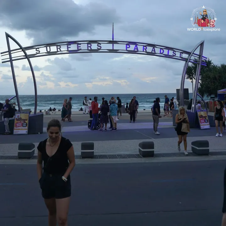 By the iconic Surfers Paradise sign, at the end of the day