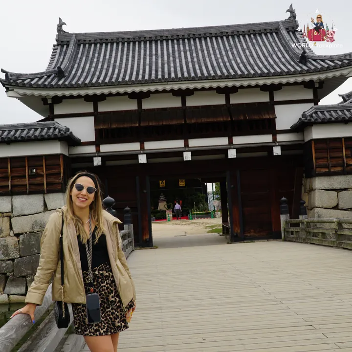 In front of the reconstructed wooden gate of Hiroshima Castle