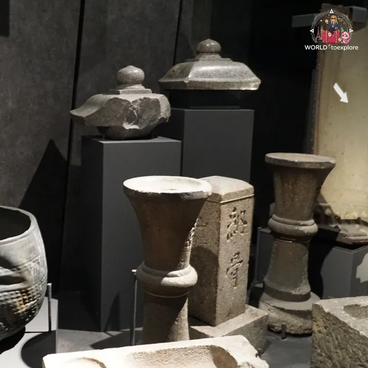 Stone pieces damaged by the explosion, including lantern tops and broken vases