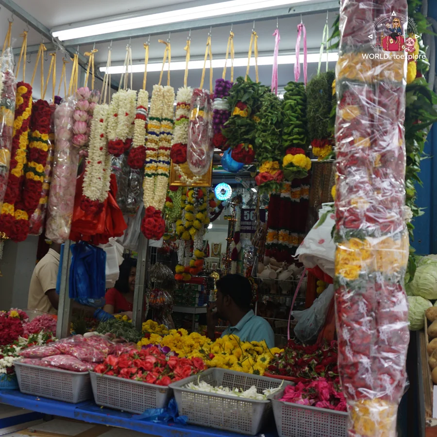 A flower stall with colourful garlands hanging in a shop in Little India, Singapore