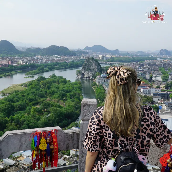Cristina from behind, looking at the Li River and Elephant Trunk Hill from the top of the hill
