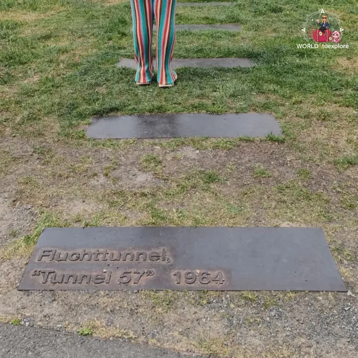 The plaque on the ground marking the escape tunnel known as Tunnel 57, from 1964, on the memorial's lawn