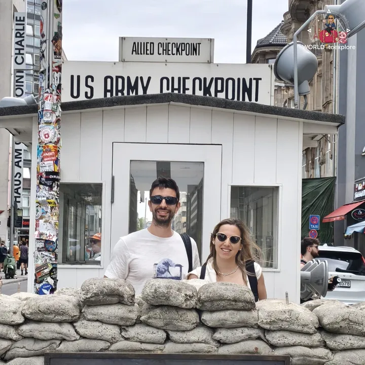 Behind the sandbags at the Checkpoint Charlie guard hut, with the US Army Checkpoint and Allied Checkpoint signs