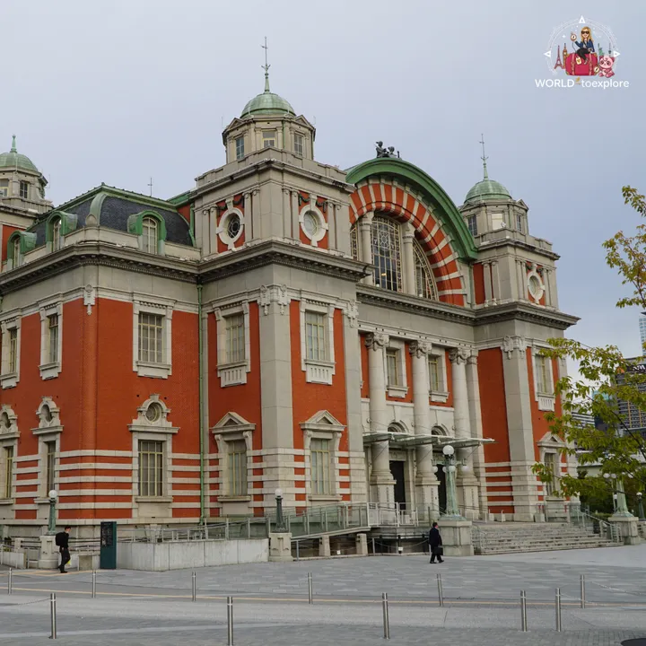 Front view of Osaka City Central Public Hall, with its green domes and red-brick and stone façade