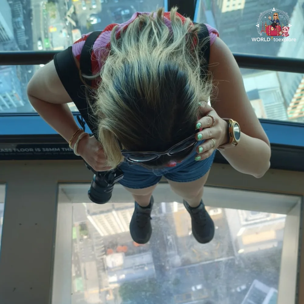 On the glass floor at the top of the Sky Tower, Auckland