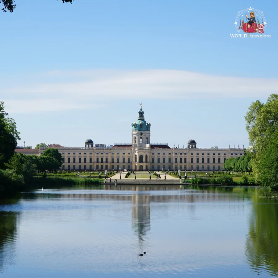 Charlottenburg Palace seen from across the lake, with the façade and dome reflected in the water