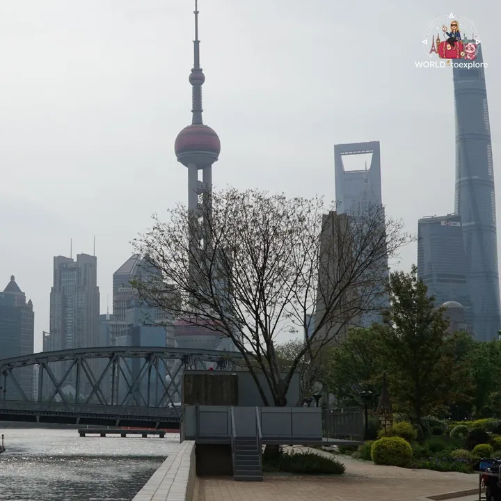 Pudong skyline with the Oriental Pearl and the Shanghai Tower, seen from the garden by the Huangpu River