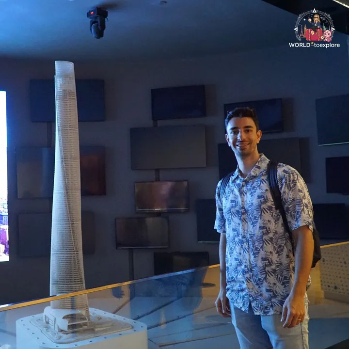 At the entrance exhibition, next to a scale model of the Shanghai Tower in a display case