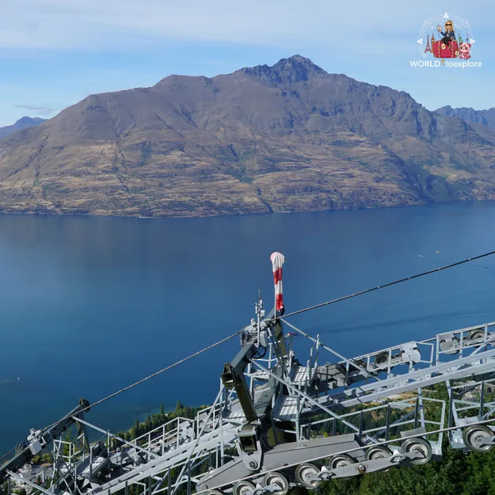 Aerial view over Lake Wakatipu and the Queenstown mountains, with the Skyline Gondola structure in the foreground