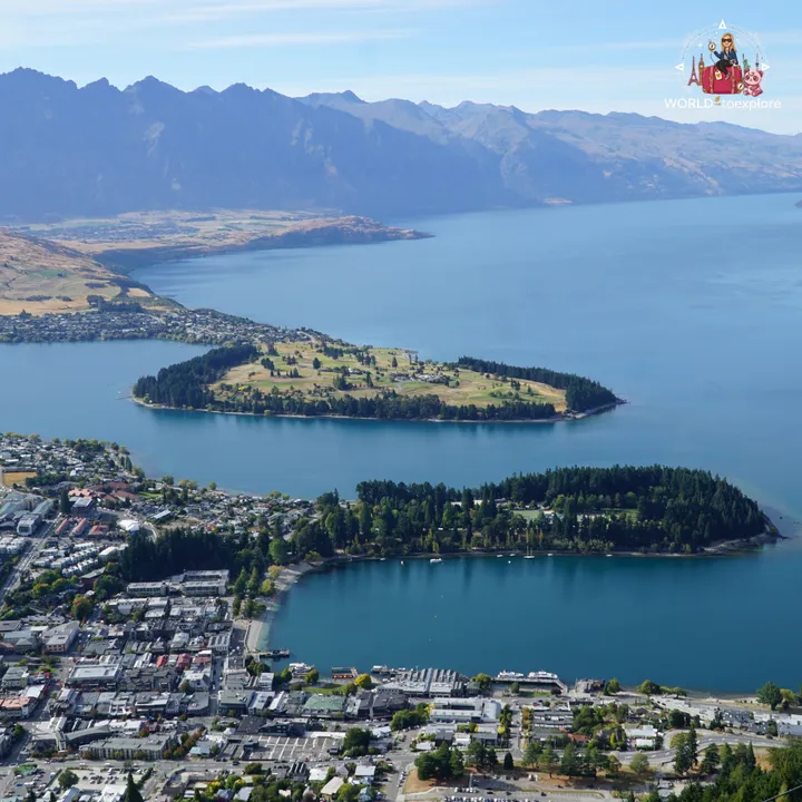 Aerial view over the green peninsula on Lake Wakatipu, with Queenstown in the foreground
