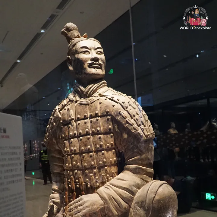Close-up of a kneeling terracotta warrior, showing the armour in detail