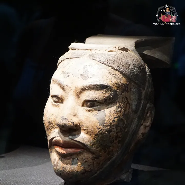 Close-up of a terracotta warrior's face, with traces of the original paint