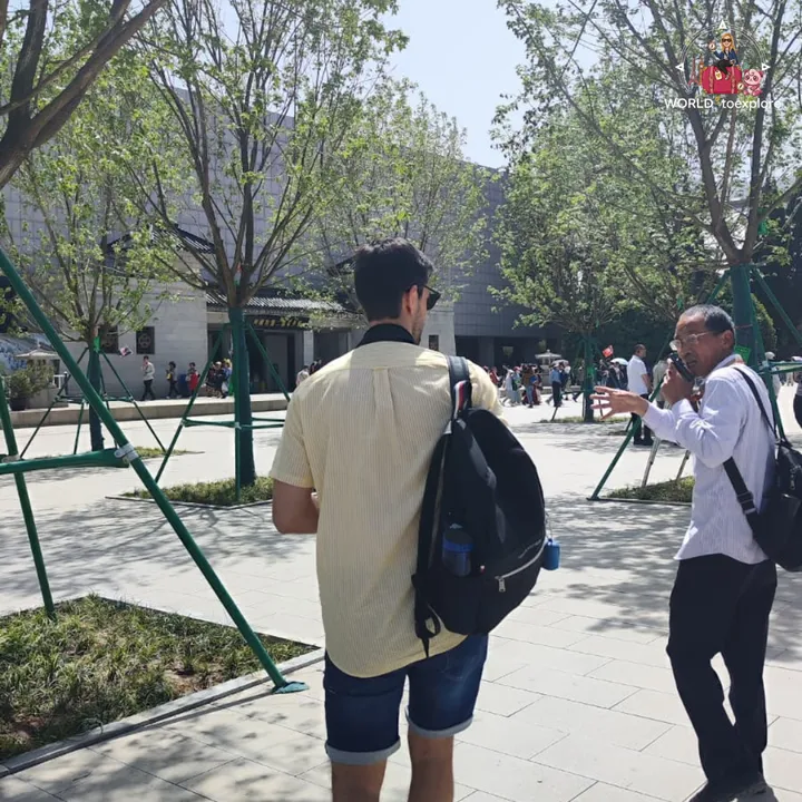 My partner with the local guide on the way to the halls of the Terracotta Army